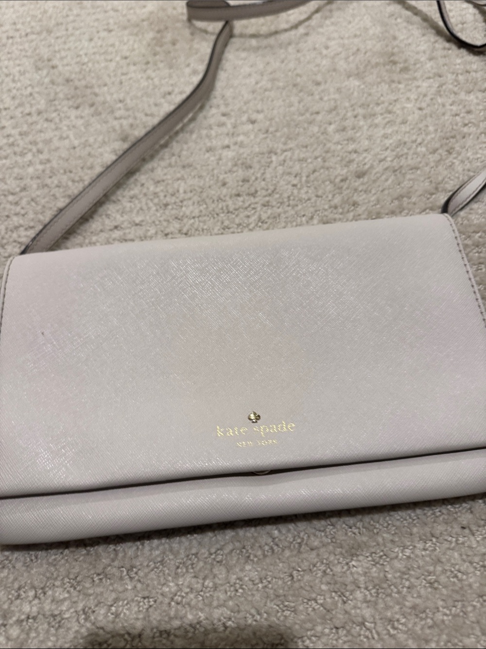 kate spade cream crossbody with gold logo